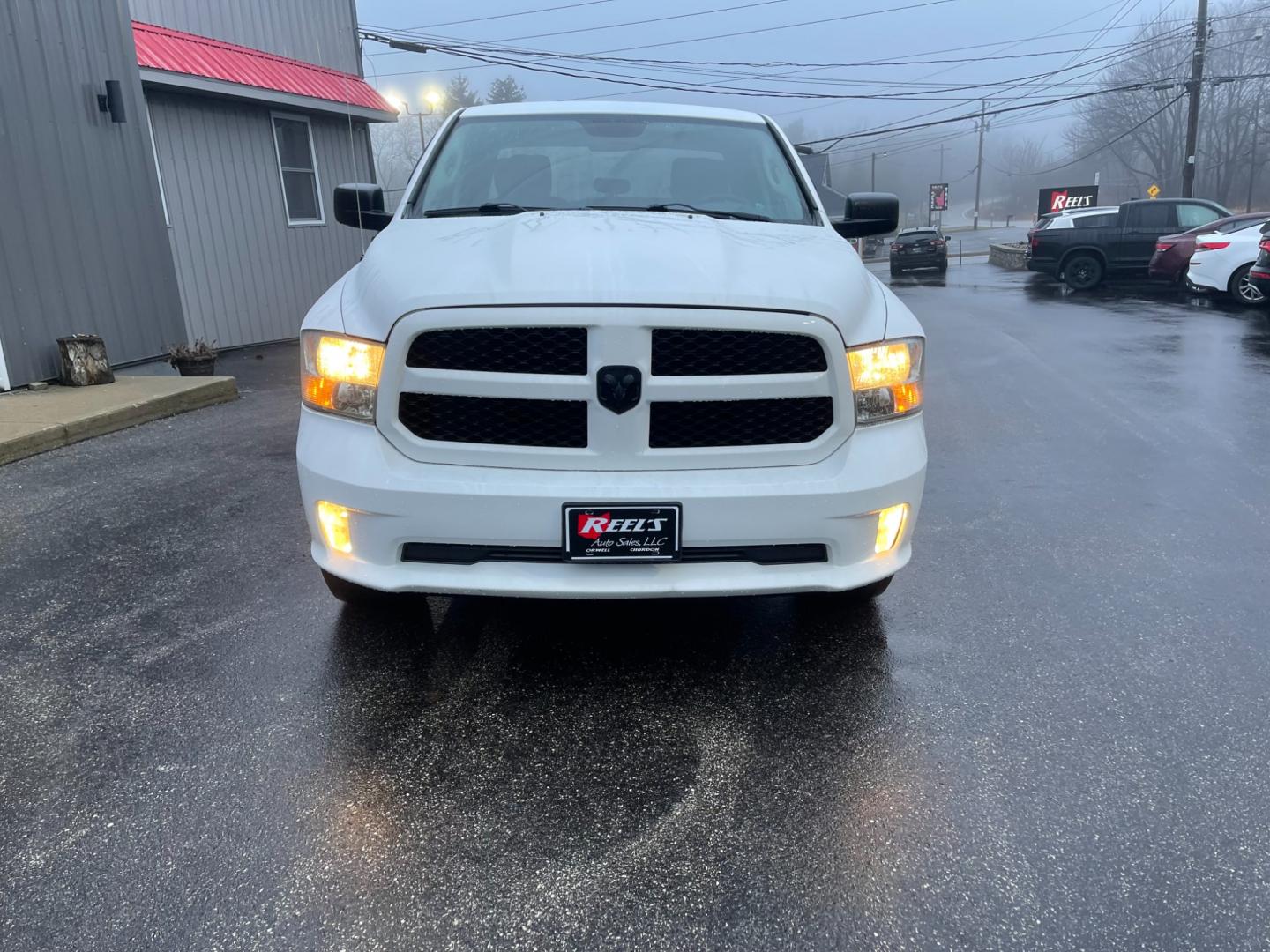 2014 White /Black RAM 1500 Express Quad Cab 4WD (1C6RR7FT5ES) with an 5.7L V8 OHV 16V engine, 8-Speed Automatic transmission, located at 11115 Chardon Rd. , Chardon, OH, 44024, (440) 214-9705, 41.580246, -81.241943 - Photo#1